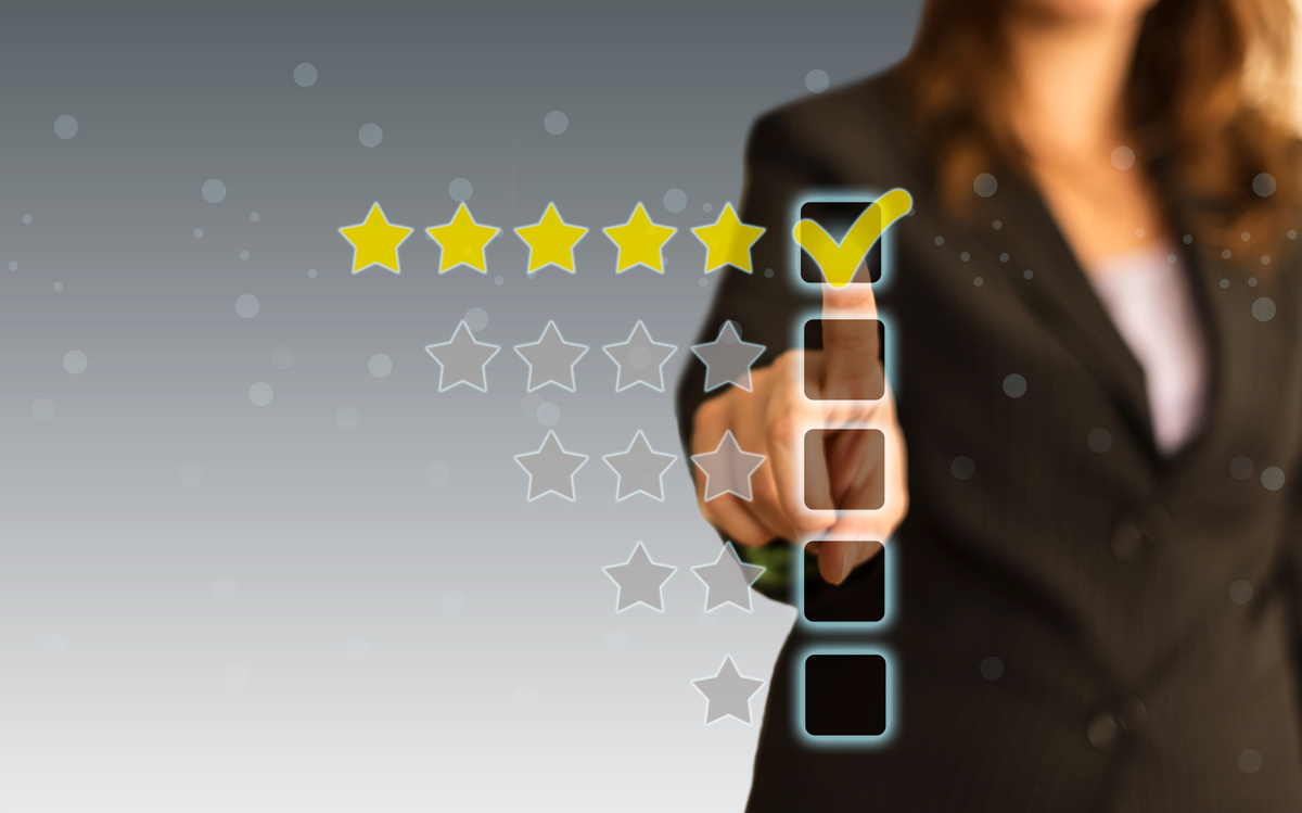 Woman Tapping on a Five Star Checkbox 